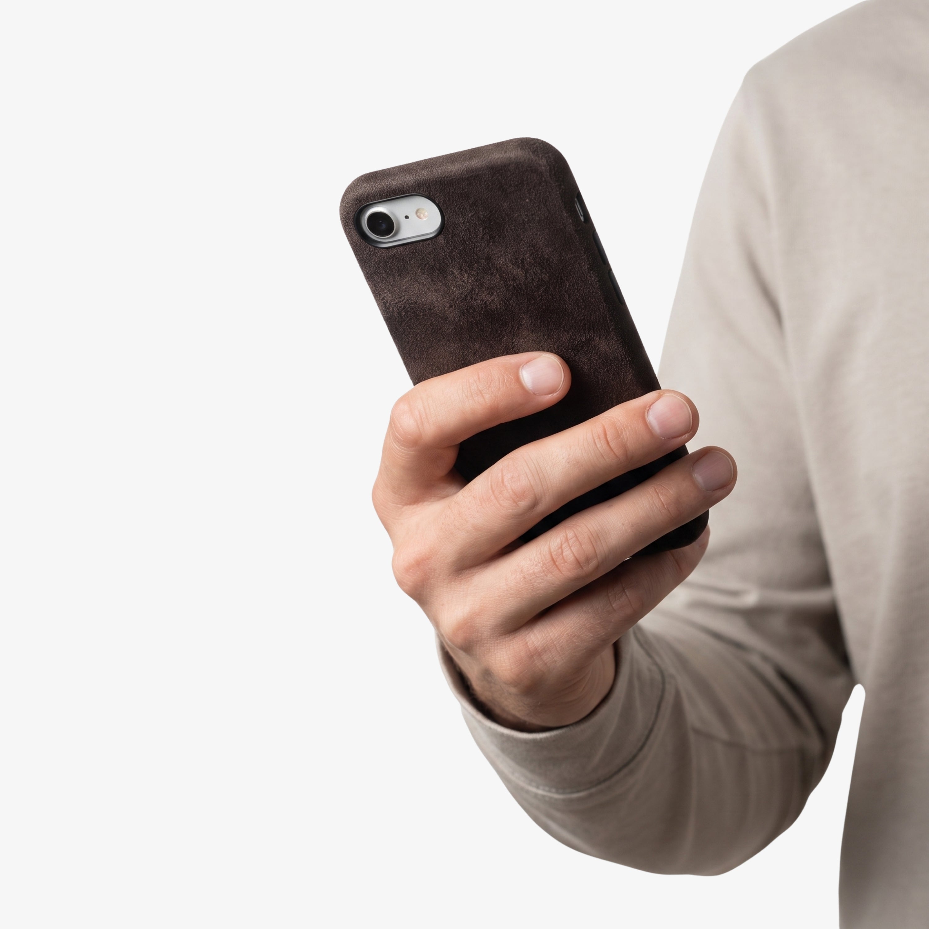 iPhone 17e Chocolate Brown Alcantara® Case held in hand